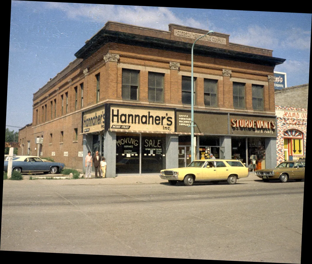 A photograph of a business with a sign for Hannaher's and Sturdevant Auto Parts.
