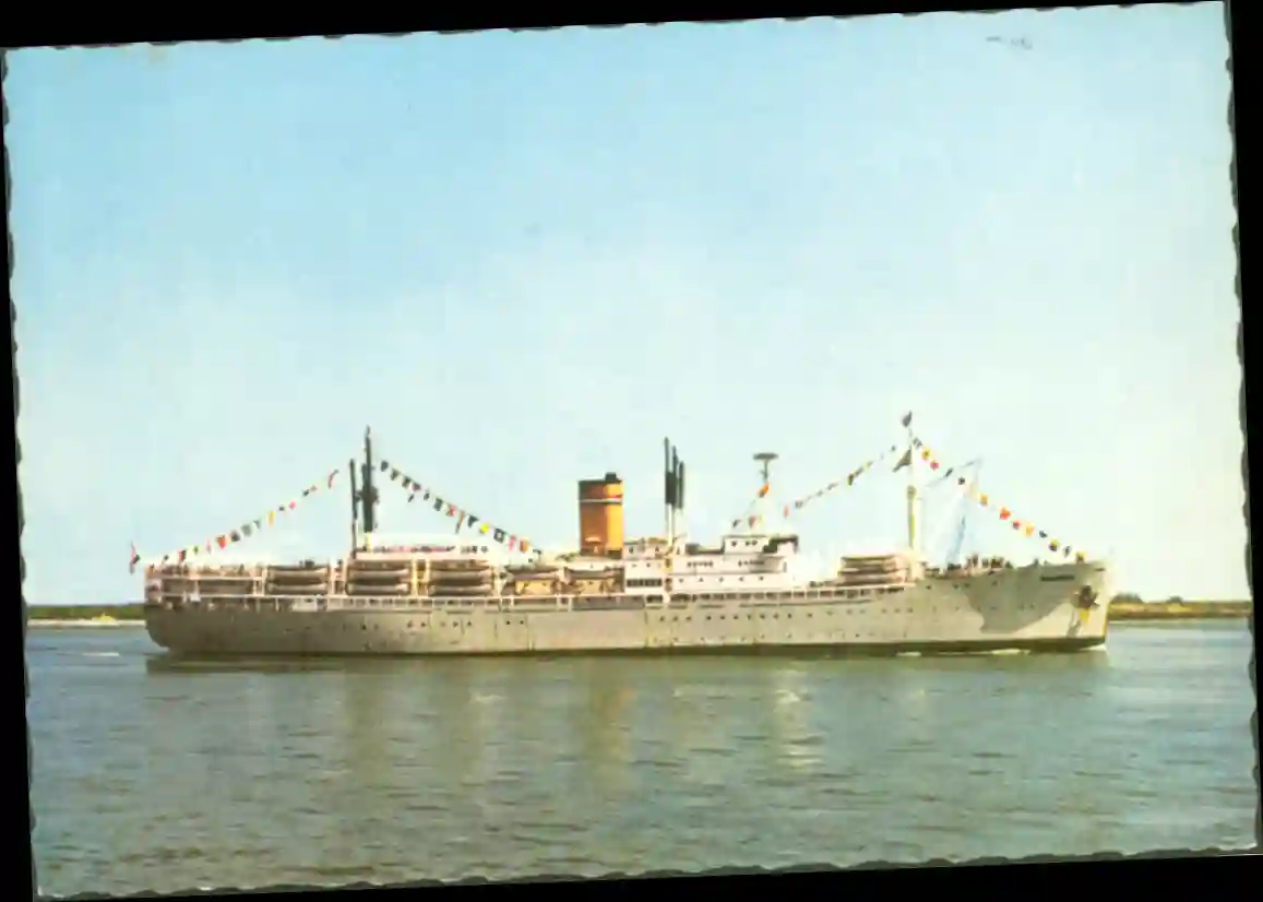 A postcard show a gray ship in quiet water, with an orange funnel and many pennants.